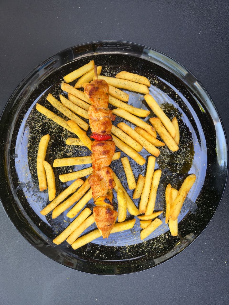 Single chicken souvlaki skewer served with french fries - Cristinas Greek Souvlaki Daventry