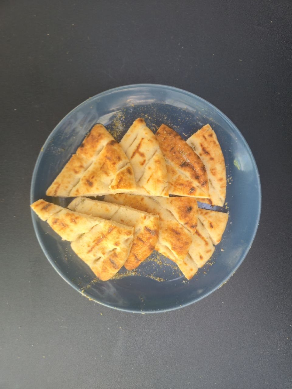 Freshly baked pitta bread cut in 8 pieces - Cristinas Greek Souvlaki Daventry