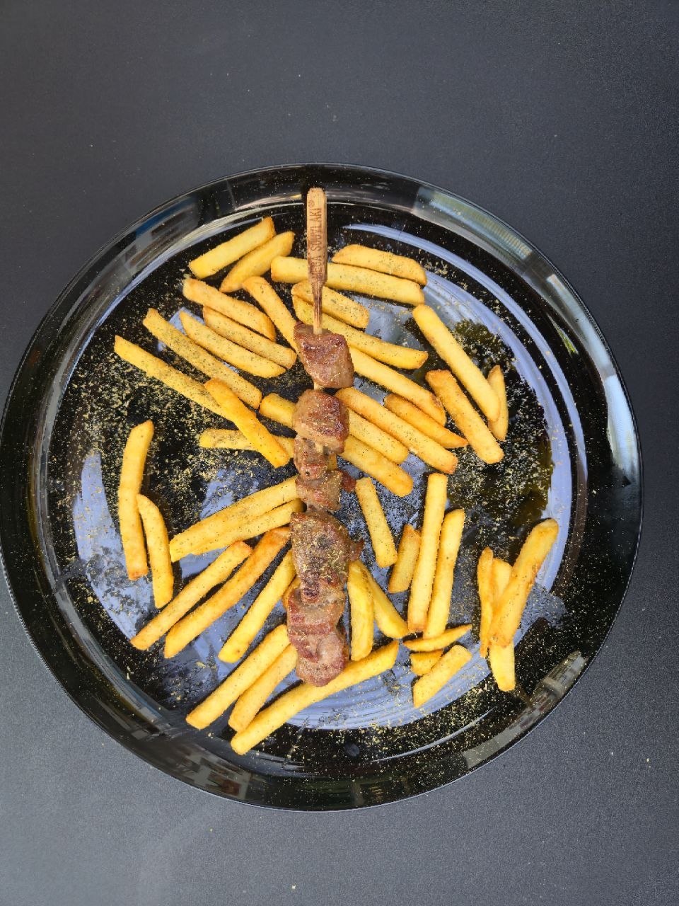 Single pork souvlaki skewer served with french fries - Cristinas Greek Souvlaki Daventry