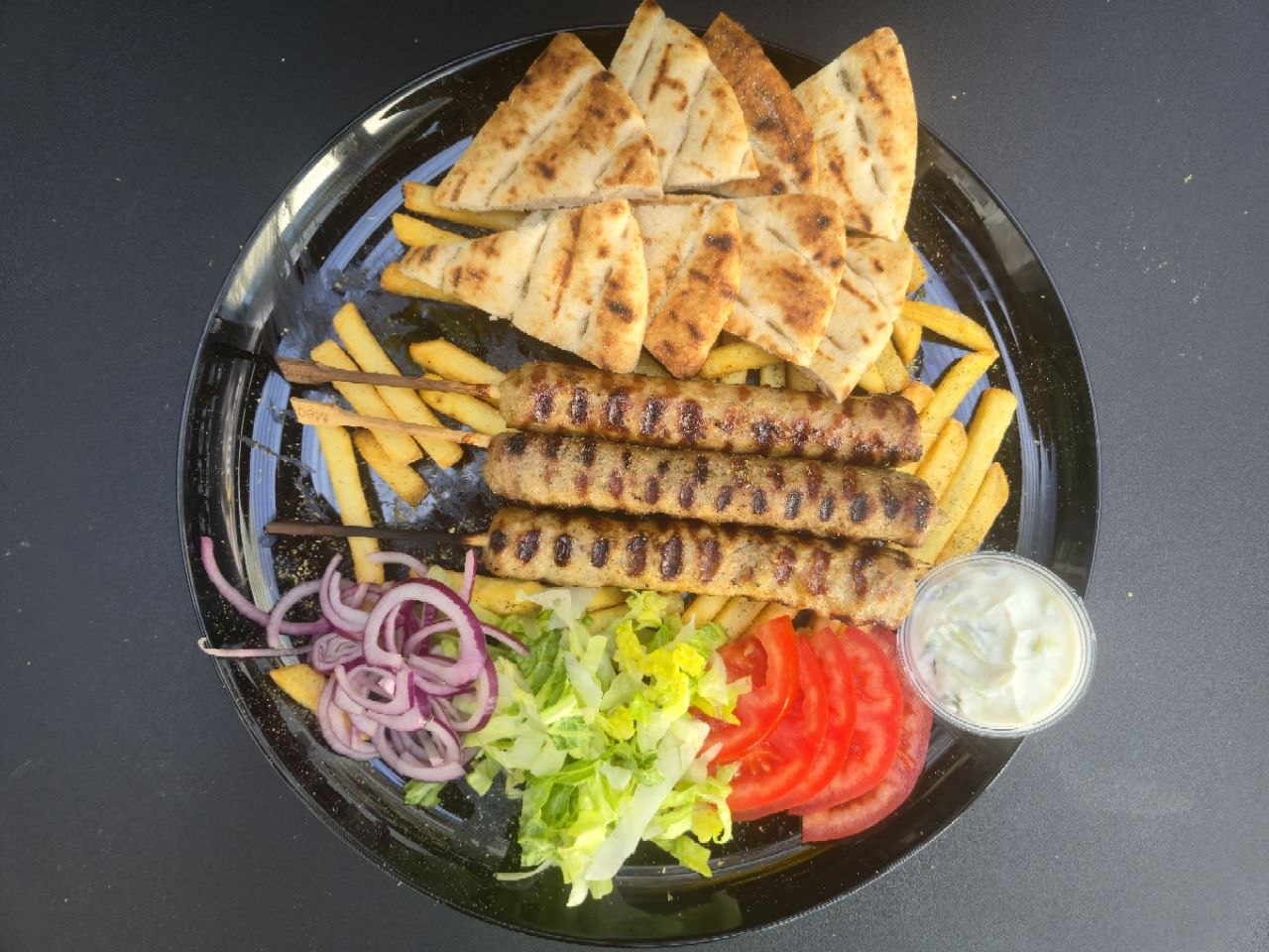 3 kebab skewers served with pitta bread, french fries and homemade tzatziki - Cristinas Greek Souvlaki Daventry