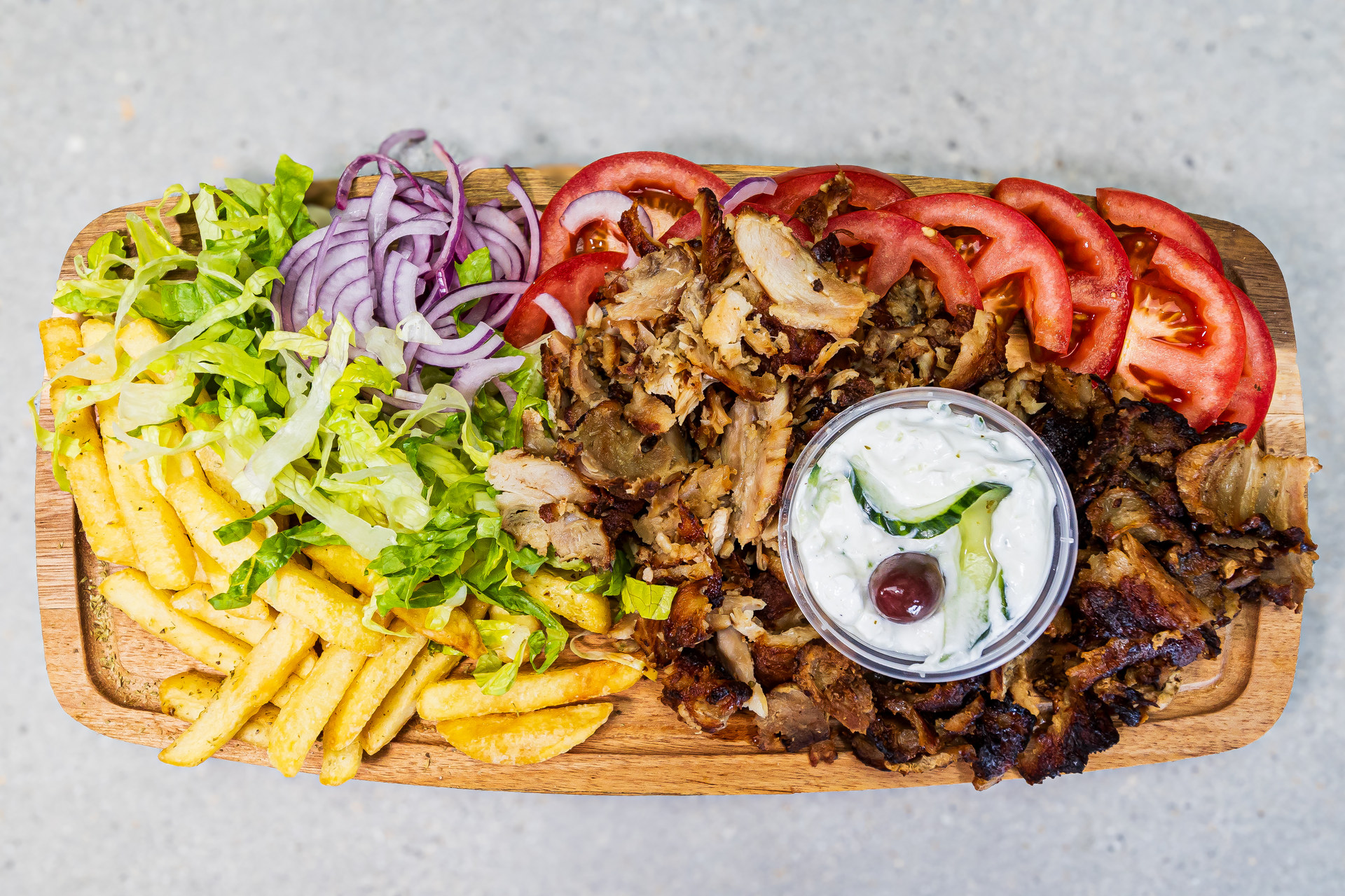 Portion of chicken gyros served with pitta bread, french fries and homemade tzatziki - Cristinas Greek Souvlaki Daventry