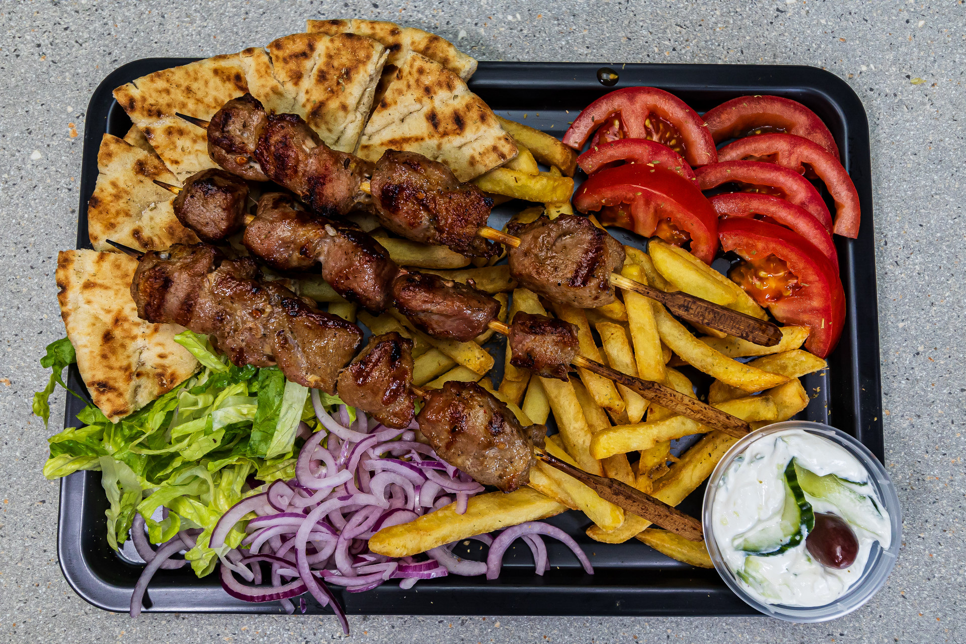 3 pork souvlaki skewers served with pitta bread, french fries and homemade tzatziki – Cristina's Greek Souvlaki Daventry