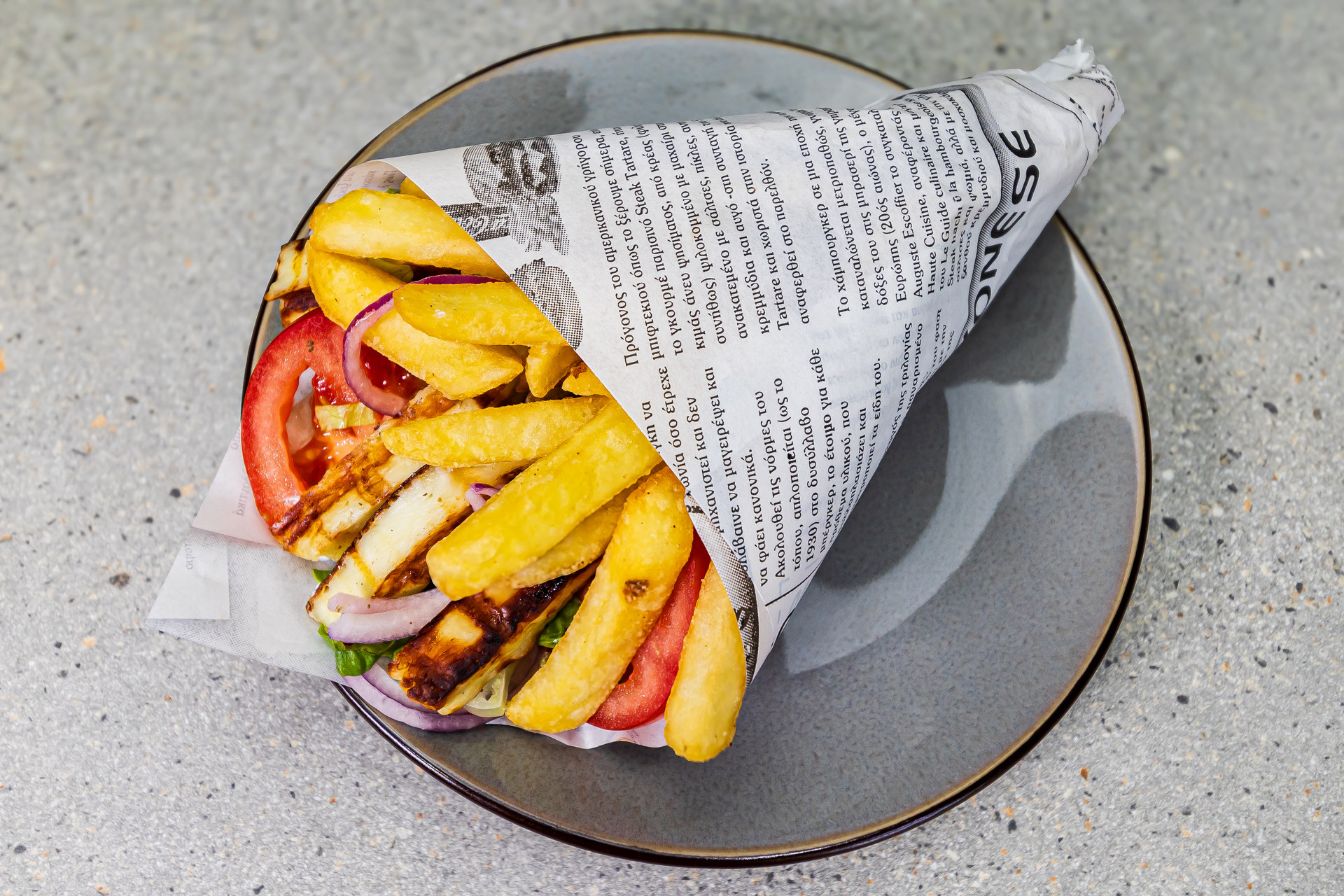 Veggie pitta wrap with grilled halloumi, tzatziki, tomato, onion, lettuce and french fries - Cristinas Greek Souvlaki Daventry